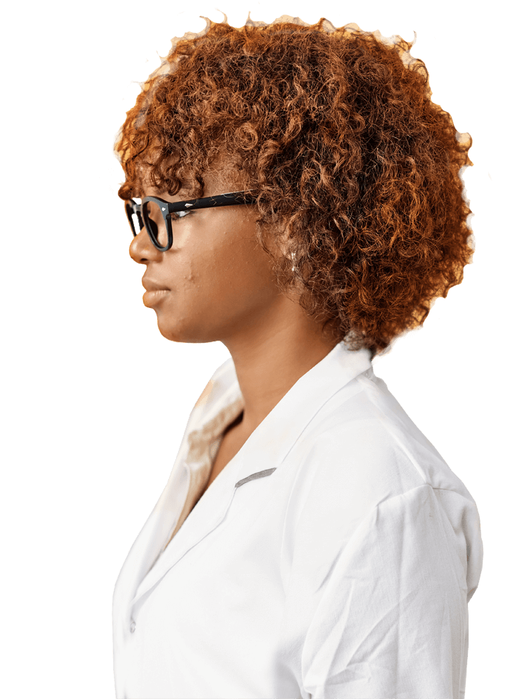 Image of a woman wearing glasses and a white coat, in profile