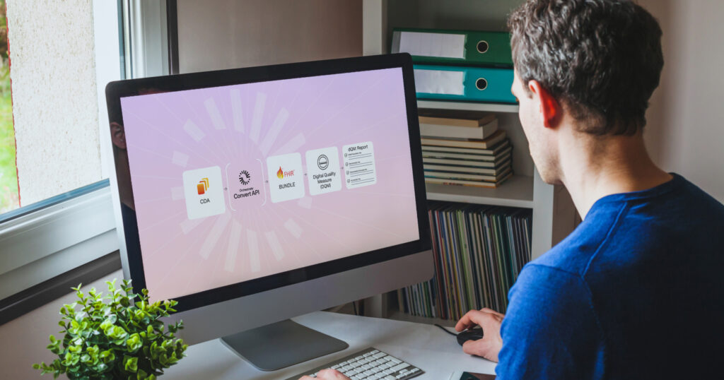 Man at computer looking at dQM process