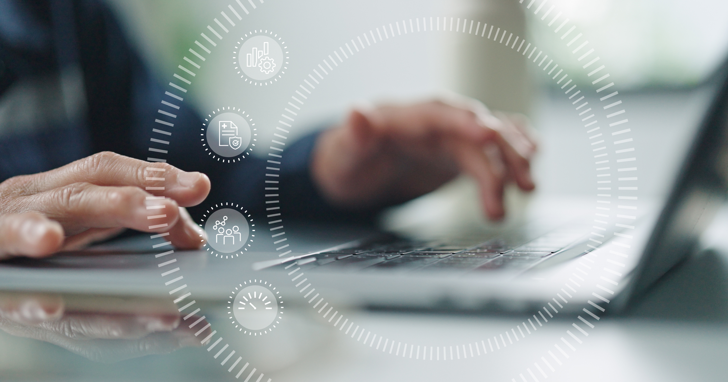 Man typing on keyboard with life insurance icons